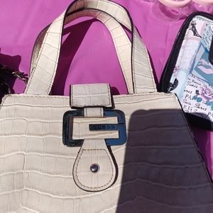 Small Beige Guess purse.